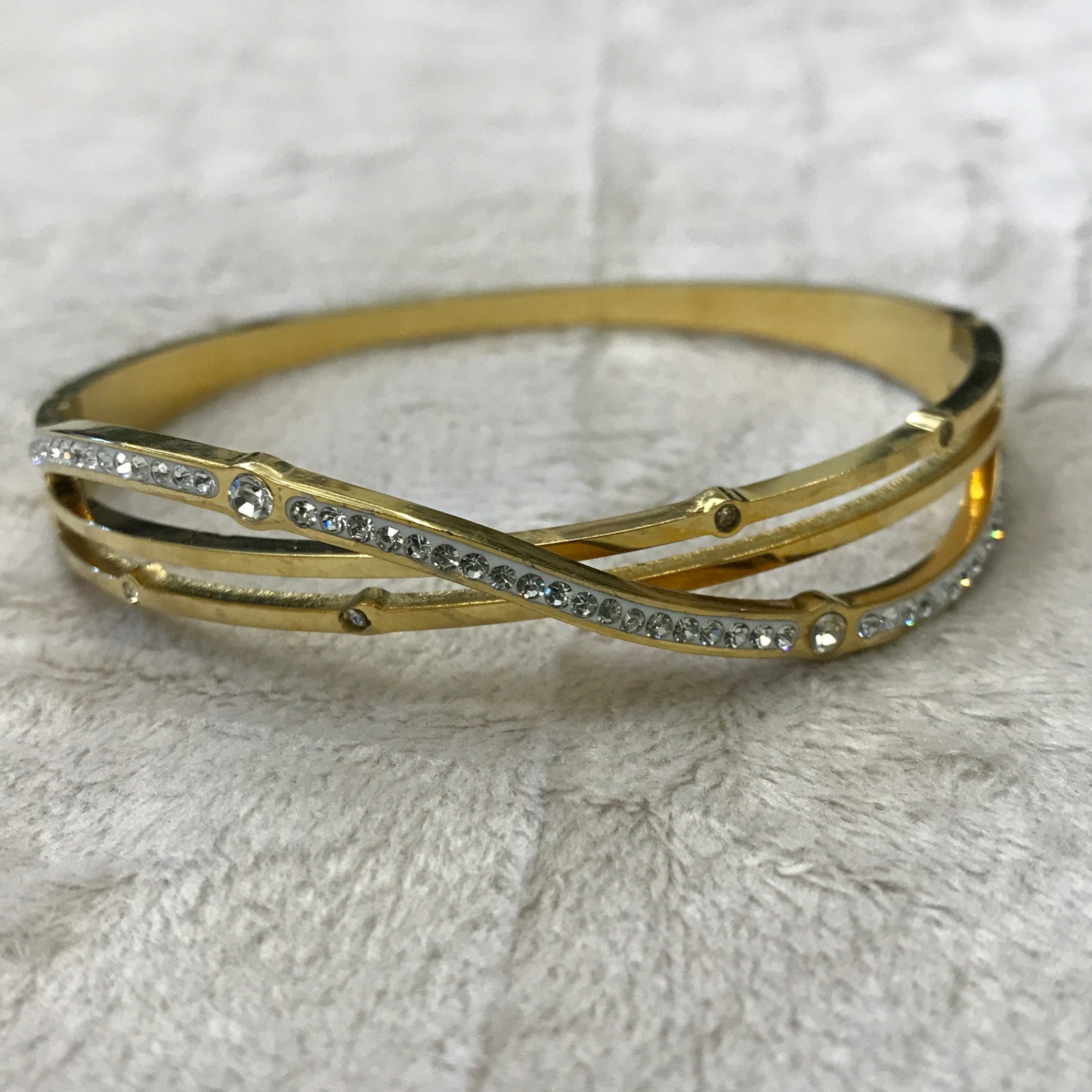 PUL0085 - Bracelete Infinito dourado com Zircônias e strass