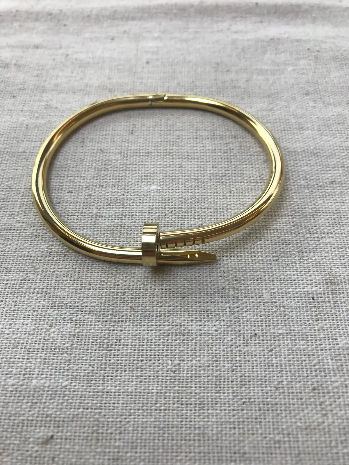 PUL0037 - Pulseira Prego Dourado em Aço